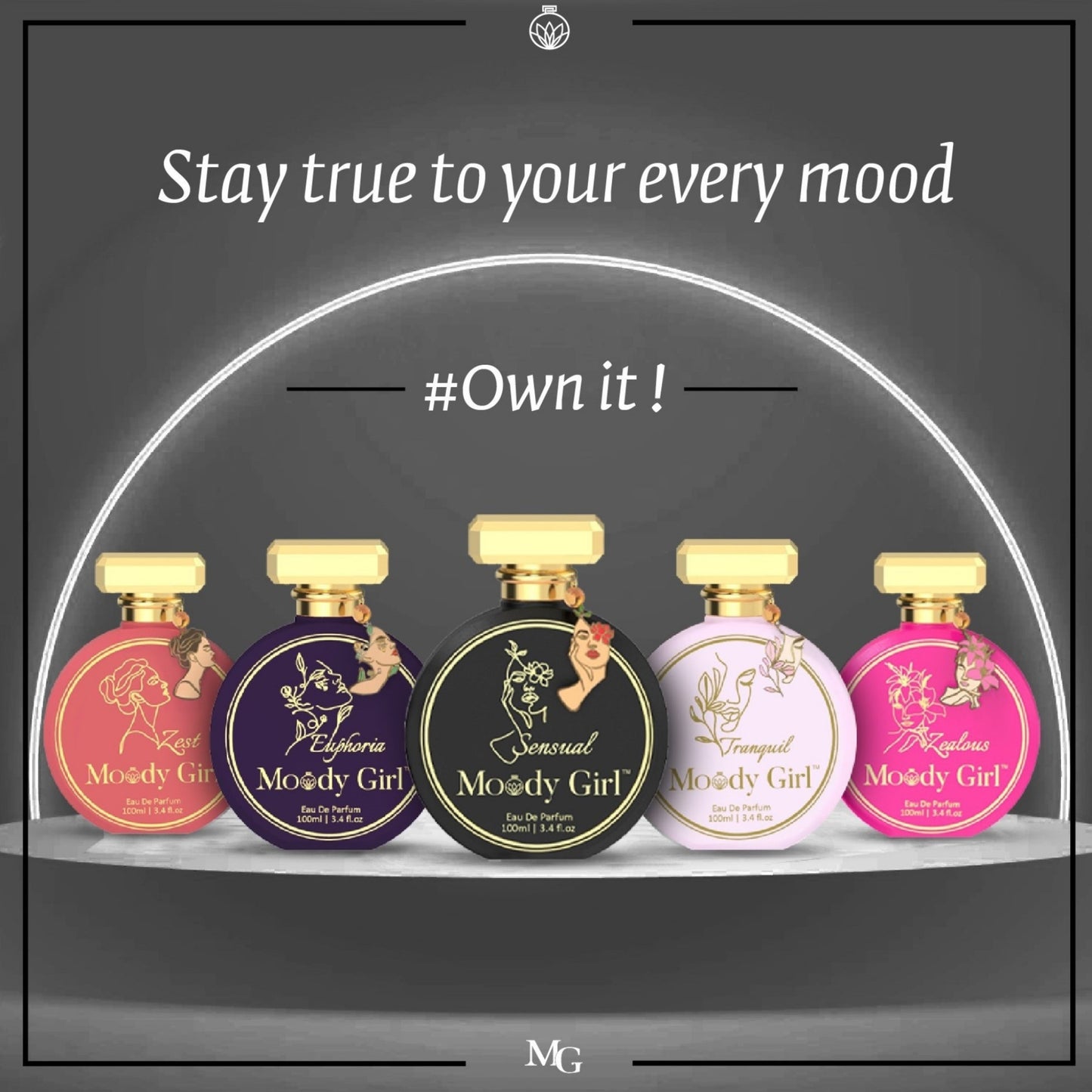 Five Moody Girl perfume bottles on a dark background with text 'Stay true to your every mood' and '#Own it!'.
